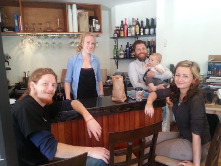 Bryan Dubien (far right) and staff pose at The Gathering, the first establishment to pay partial staff wages in Salt Spring Dollars. Photo: Alina Konevski