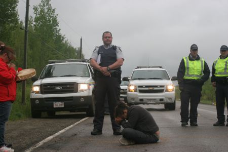 On June 9th, Suzanne Patles was arrested for mischief while praying in front of SWN's seismic testing equipment. It was the third arrest of the summer. Photo by Miles Howe