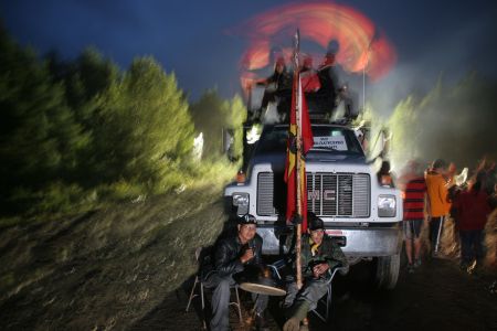 A full SWN work contingent was blockaded on July 28th for over eight hours. The night marked a turning point, as it was the first time the Mi'kmaq Warriors Society acted in conjunction with anti-shale gas activists. Two days later, SWN announced it was leaving Kent County for the summer. Photo by Miles Howe