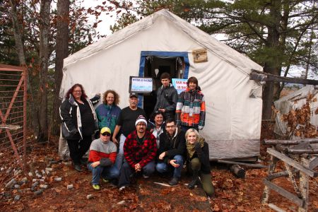 Algonquin organizers pose with The Dominion and Montreal activists in front of an abandoned test site in the proposed centre of the open-pit mine. Photo by Claire Stewart-Kanigan