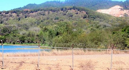 Now closed, Goldcorp's open pit San Martin mine still looms in the background of an alleged ecotourism project in Honduras. Photo by Rachel Deutsch